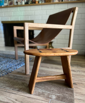 Wooden stool and chair in living room setting